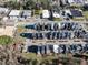 This aerial shot features modern homes, sidewalks, and street parking spaces at 618 Velma Hopkins Ln, Raleigh, NC 27603