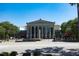 A view of the Raleigh Memorial Auditorium, set amongst green trees at 618 Velma Hopkins Ln, Raleigh, NC 27603