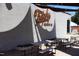 Exterior view of the taproom featuring outdoor seating with shade coverings at 618 Velma Hopkins Ln, Raleigh, NC 27603