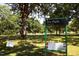 Scenic park view featuring green space, large trees, and a sign for Dix Park at 618 Velma Hopkins Ln, Raleigh, NC 27603