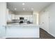 An open kitchen featuring white cabinets, granite countertops, and stainless steel appliances at 105 Ambergate Ct, Rocky Mount, NC 27804