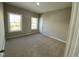 Neutral bedroom with plush carpeting, natural light from two windows, and a calming atmosphere at 112 Ambergate Ct, Rocky Mount, NC 27804