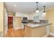 Bright kitchen with granite countertops, stainless appliances, and a breakfast bar at 5513 Parkwood Dr, Raleigh, NC 27612