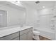 Bathroom with tub, vanity, and toilet at 292 Chestnut Oak Ln, Lillington, NC 27546