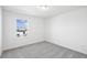 Spacious bedroom with neutral carpeting and a window at 292 Chestnut Oak Ln, Lillington, NC 27546