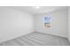 Bright bedroom with neutral carpet and window at 292 Chestnut Oak Ln, Lillington, NC 27546