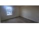 Bright bedroom with carpet flooring and a large window at 292 Chestnut Oak Ln, Lillington, NC 27546