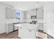 Modern kitchen with gray cabinets, quartz countertops and stainless steel appliances at 292 Chestnut Oak Ln, Lillington, NC 27546