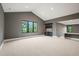 Finished basement with an open layout, high ceilings, and a stylish bar area at 1701 Legacy Ridge Ln, Wake Forest, NC 27587