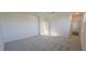Bedroom with carpet, hall access, and natural light at 191 Robert Howe Dr, Fuquay Varina, NC 27526