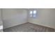 Comfortable bedroom with carpet and two windows at 191 Robert Howe Dr, Fuquay Varina, NC 27526
