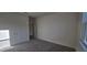 Spacious bedroom with neutral carpet, double closets, and large window at 191 Robert Howe Dr, Fuquay Varina, NC 27526