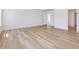 Spacious bedroom with hardwood floors, crown molding, and view of the entry way at 401 Winding Creek Dr, Lillington, NC 27546