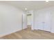 Bright bedroom with hardwood floors and view of the entry way at 401 Winding Creek Dr, Lillington, NC 27546