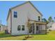 Back of house featuring screened in porch and young tree at 401 Winding Creek Dr, Lillington, NC 27546