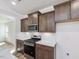 Beautiful kitchen features stainless steel appliances, ample cabinet space, and quartz countertops at 401 Winding Creek Dr, Lillington, NC 27546