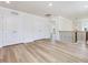 Open loft area with hardwood floors and view of the entry way at 401 Winding Creek Dr, Lillington, NC 27546
