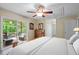 Bedroom with a wooden bed frame and a large sliding door to a deck at 2723 New Sharon Church Rd, Hillsborough, NC 27278