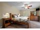 View of a bedroom with light hardwood floors, ceiling fan, and bed set at 2723 New Sharon Church Rd, Hillsborough, NC 27278