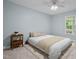 Cozy bedroom with neutral tones, a ceiling fan and a window view of nature at 2723 New Sharon Church Rd, Hillsborough, NC 27278