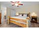 A bedroom showing a wood frame bed with nightstands on either side at 2723 New Sharon Church Rd, Hillsborough, NC 27278