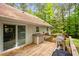 View of a wooden deck featuring outdoor cooking equipment and adjacent to the house at 2723 New Sharon Church Rd, Hillsborough, NC 27278