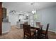 Bright dining area featuring a wooden table, patio access, and a view of the outdoor grill at 2723 New Sharon Church Rd, Hillsborough, NC 27278