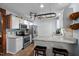 Modern kitchen features stainless steel appliances, granite countertops, and a stylish tile backsplash at 2723 New Sharon Church Rd, Hillsborough, NC 27278