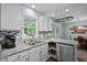 Bright kitchen with stainless appliances, granite countertops, and window views of nature at 2723 New Sharon Church Rd, Hillsborough, NC 27278