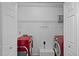 Laundry room featuring a modern red washer and dryer at 2723 New Sharon Church Rd, Hillsborough, NC 27278