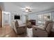 Cozy living room with comfortable seating, built-in shelving, and natural light at 2723 New Sharon Church Rd, Hillsborough, NC 27278
