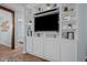 Bright living room featuring a built-in entertainment center and hardwood floors at 2723 New Sharon Church Rd, Hillsborough, NC 27278