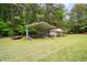 Outbuilding with ample space for equipment and projects, set in a spacious yard at 2723 New Sharon Church Rd, Hillsborough, NC 27278