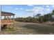 Expansive backyard view from porch, showing the property and surrounding trees at 30 Diamond Creek Dr, Zebulon, NC 27597