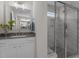 Bathroom featuring a vanity with framed mirror, and a glass shower with tiled walls and base at 30 Diamond Creek Dr, Zebulon, NC 27597