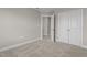 Bedroom featuring neutral walls and carpet, white baseboards and access to a closet at 30 Diamond Creek Dr, Zebulon, NC 27597