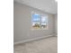 Bedroom featuring neutral walls, carpet, and a large window at 30 Diamond Creek Dr, Zebulon, NC 27597