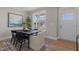 Bright dining area with a modern black table set, large window, and stylish decor at 30 Diamond Creek Dr, Zebulon, NC 27597