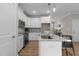 Modern kitchen featuring granite countertops, stainless steel appliances, and ample cabinet space at 30 Diamond Creek Dr, Zebulon, NC 27597