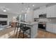 Open-concept kitchen with granite counters, stainless appliances, and a view of the living area at 30 Diamond Creek Dr, Zebulon, NC 27597