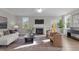 Inviting living room with a fireplace, neutral decor, and ample natural light at 30 Diamond Creek Dr, Zebulon, NC 27597