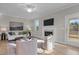 Stylish living room featuring a fireplace, comfortable seating, and a relaxing ambiance at 30 Diamond Creek Dr, Zebulon, NC 27597