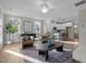 Open-concept living area with views of the kitchen, fireplace, and large windows at 30 Diamond Creek Dr, Zebulon, NC 27597