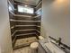 Contemporary bathroom showcasing tiled walk-in shower with marble and bronze fixtures at 4905 Hidden Pasture Way, Zebulon, NC 27597