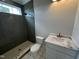 Bathroom features a tiled walk-in shower, providing a modern and accessible bathing solution at 4905 Hidden Pasture Way, Zebulon, NC 27597