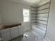Bathroom under construction showing a tiled shower/tub and unfinished white cabinets at 4905 Hidden Pasture Way, Zebulon, NC 27597