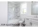 Modern bathroom with white marble tile and white vanity at 4905 Hidden Pasture Way, Zebulon, NC 27597