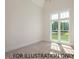 Spacious bedroom featuring a large window with natural light and neutral carpet at 4905 Hidden Pasture Way, Zebulon, NC 27597