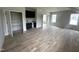 Spacious bonus room includes hardwood floors, wet bar, and natural light at 4905 Hidden Pasture Way, Zebulon, NC 27597