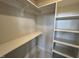 A practical closet with shelving, designed to provide ample storage space for clothing and personal items at 4905 Hidden Pasture Way, Zebulon, NC 27597